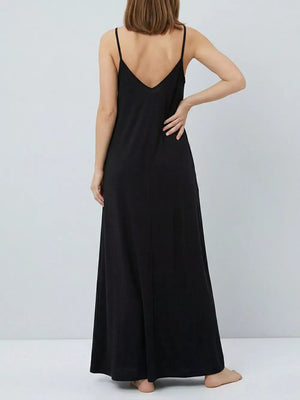 Black maxi dress with spaghetti straps and V-neck, flowing skirt.