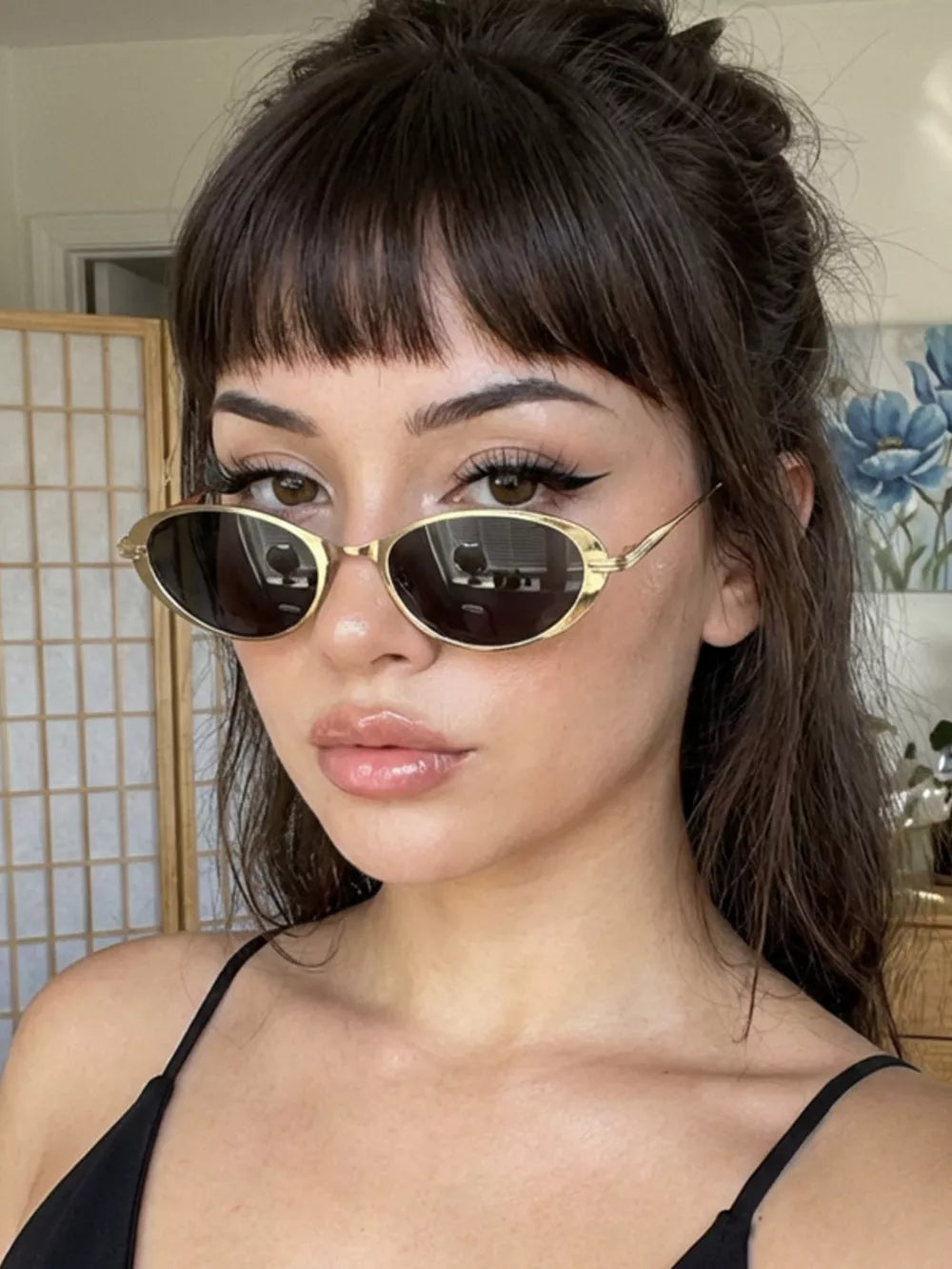 sunglasses in gold featuring UV400 protection and oval fit