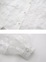 White lace maxi dress with pearl buttons and lantern sleeves.