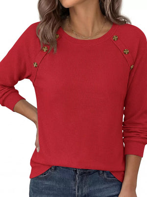 Blue t-shirt with decorative buttons and long sleeve