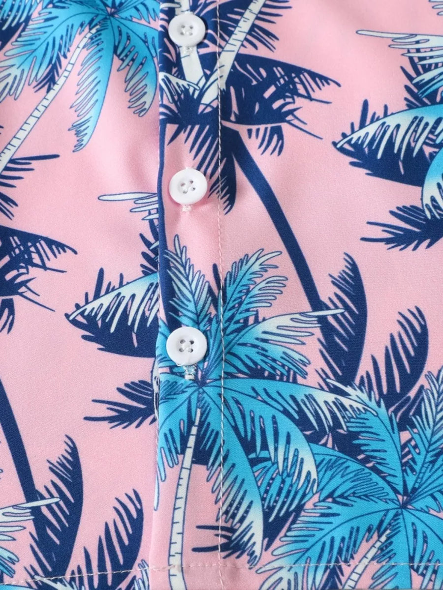 Pink cotton baby shirt with blue palm tree print and white buttons