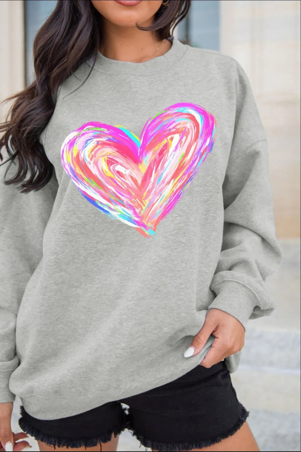 Gray crewneck sweatshirt with a colorful painted heart graphic.