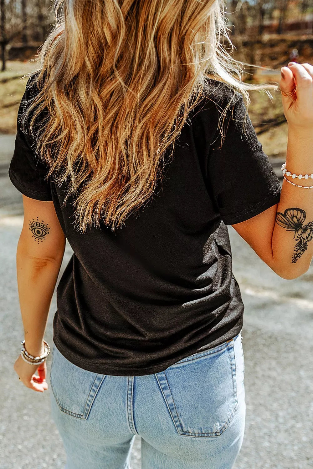 Black polyester t-shirt with short sleeves and a round neckline, featuring a leopard print basketball graphic.