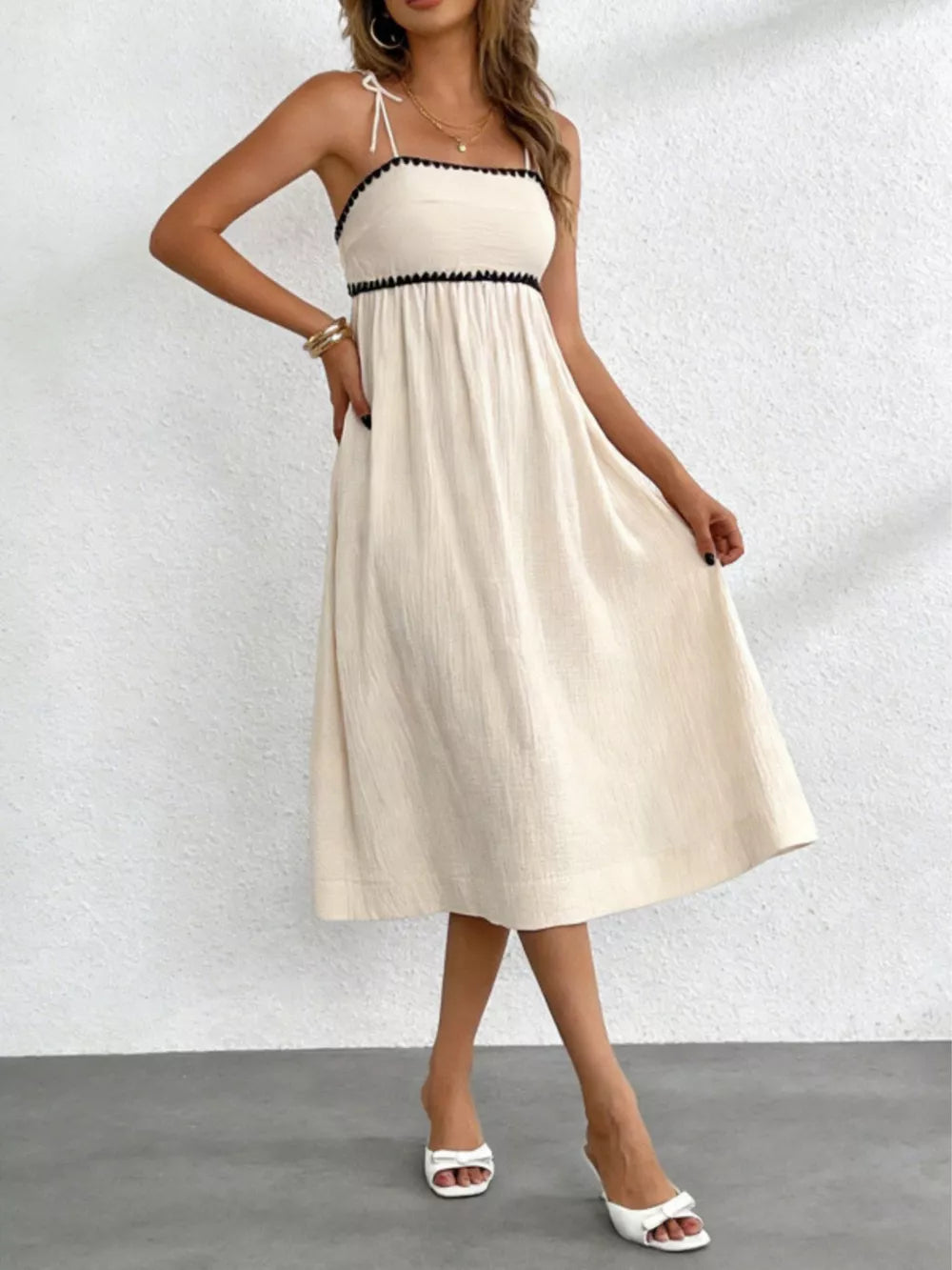 midi dress in cream featuring tied shoulders and A-line fit