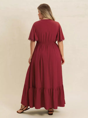 Burgundy maxi dress with flutter sleeves and lace trim, tiered hem, cinched waist