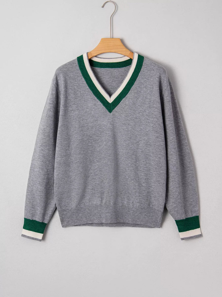 Gray ribbed V-neck sweater with green and white stripe trim on neckline and cuffs.