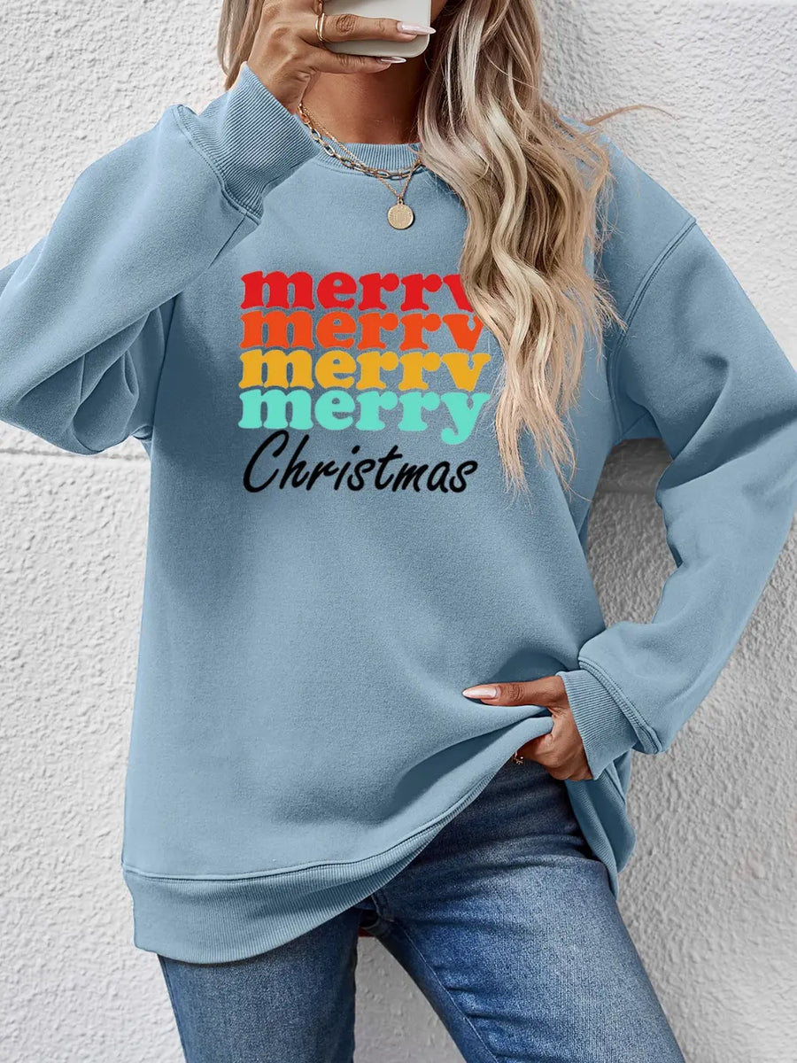Light blue crewneck sweatshirt with retro "Merry Christmas" graphic in red, orange, yellow, and teal.