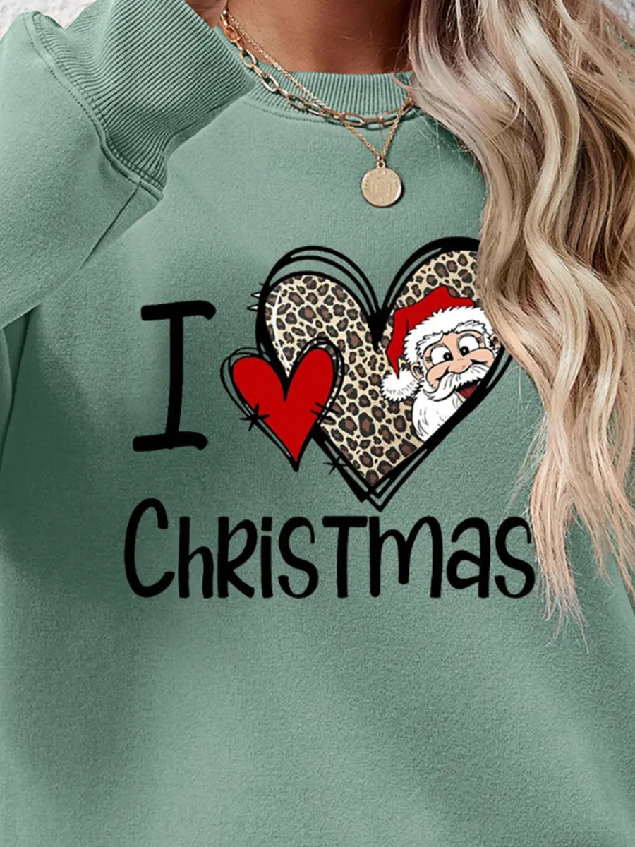 Sage green crewneck sweatshirt with festive heart graphic and I Love Christmas text.