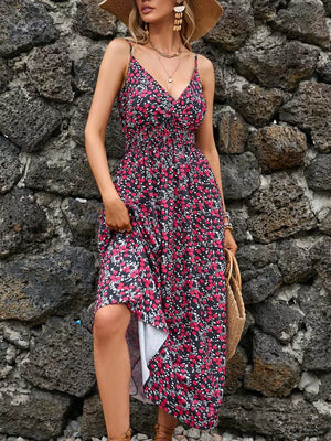 Maxi dress with a black floral print, V-neck, spaghetti straps, and smocked waist.