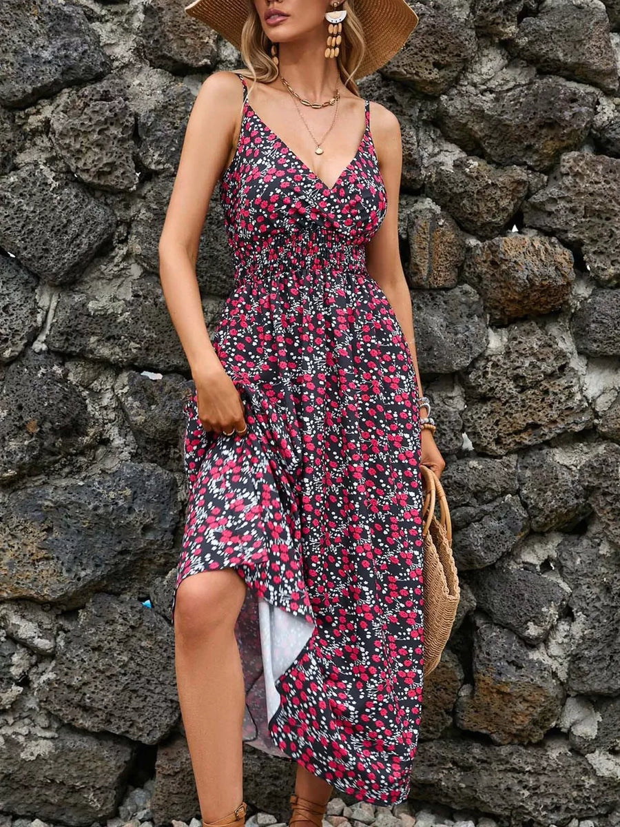 Maxi dress with a black floral print, V-neck, spaghetti straps, and smocked waist.