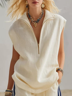 Cream linen sleeveless zip-neck top with gold zipper and collar