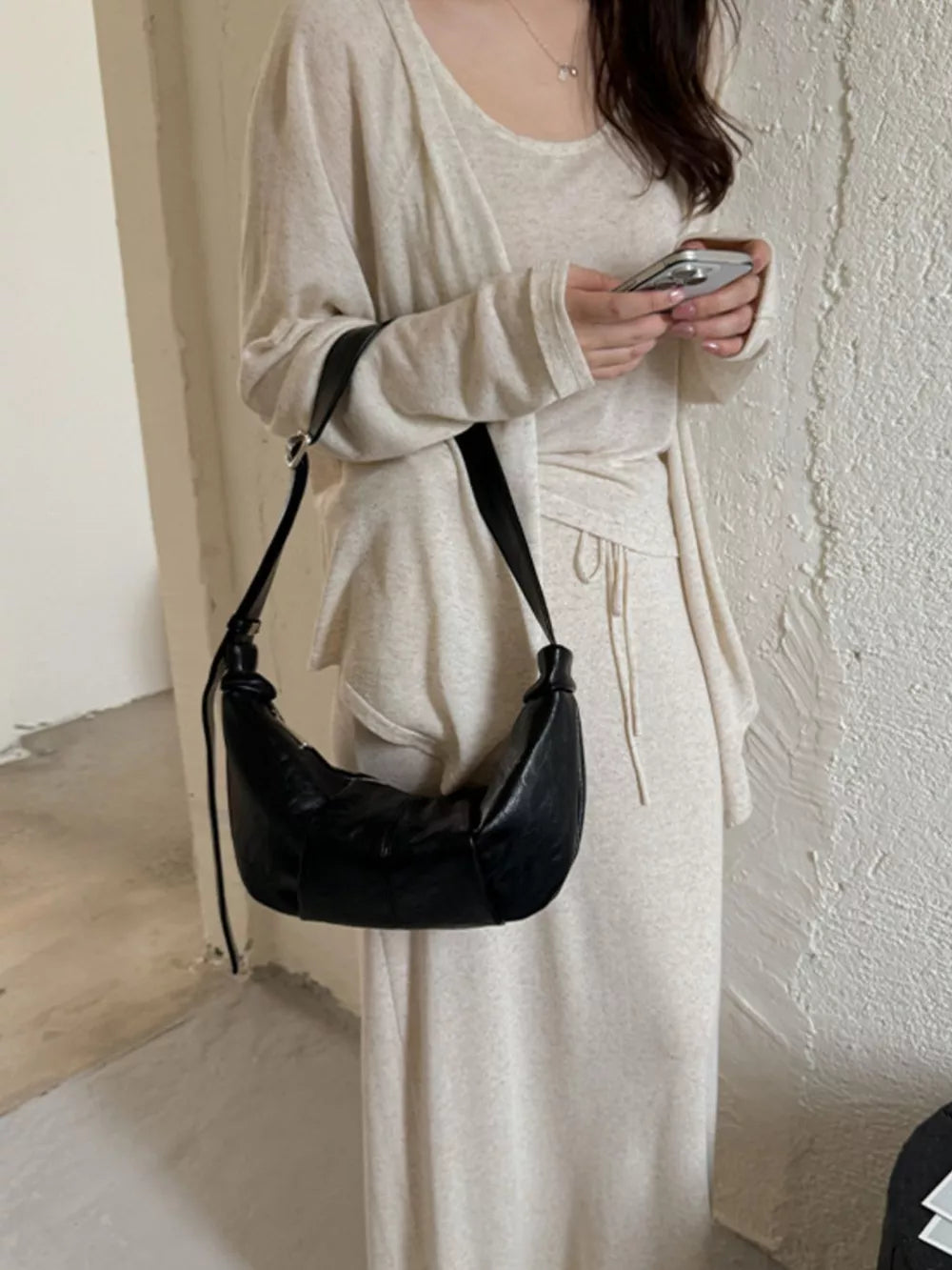 Croissant Leather Shoulder Bag in black with adjustable strap