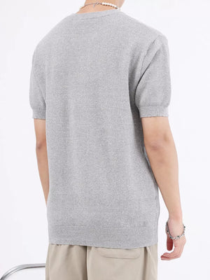 Men's gray knitted henley undershirt with short sleeves and waffle texture.