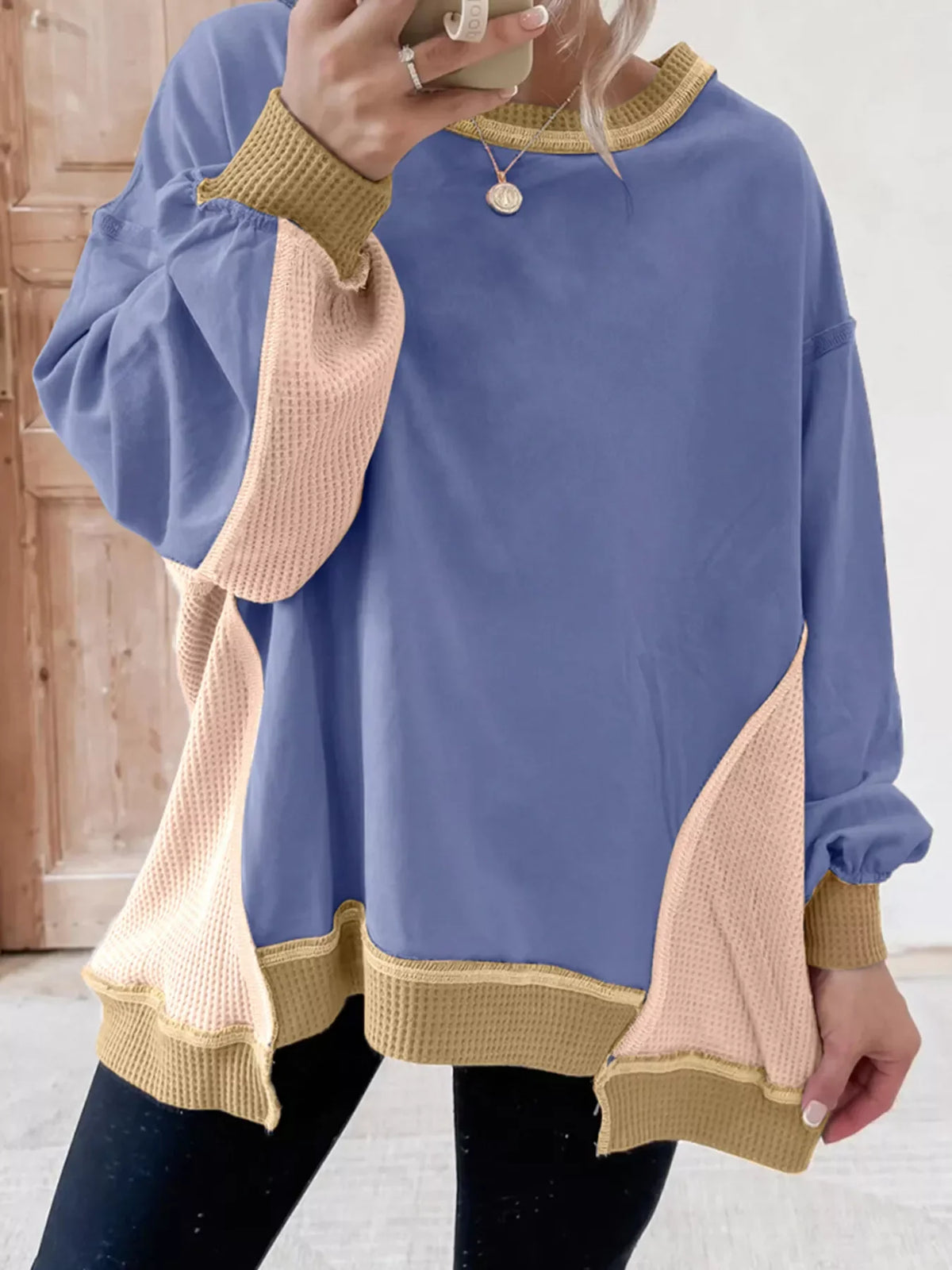 Dusty blue tunic with waffle knit contrast panels and trim.