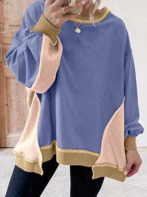 Dusty blue tunic with waffle knit contrast panels and trim.