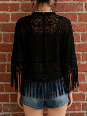 Black lace bohemian cover-up with fringe detail and sheer sleeves.