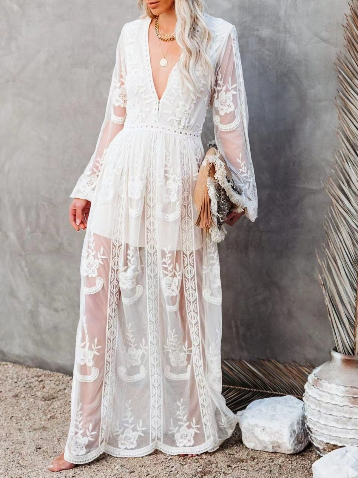 White floral lace maxi dress with V-neck, bell sleeves, and a slit.