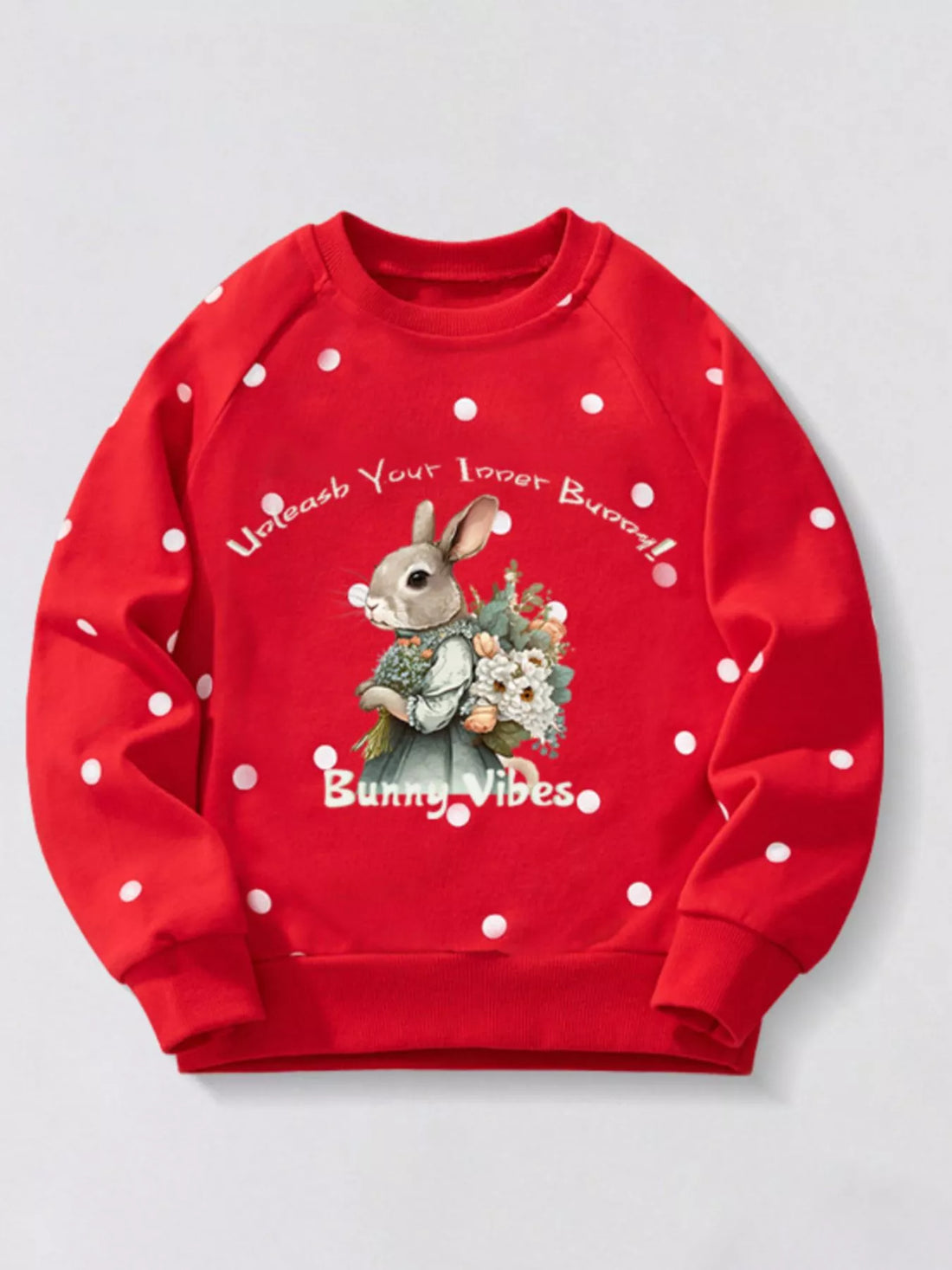 Red polka dot cotton sweatshirt with bunny graphic and text.