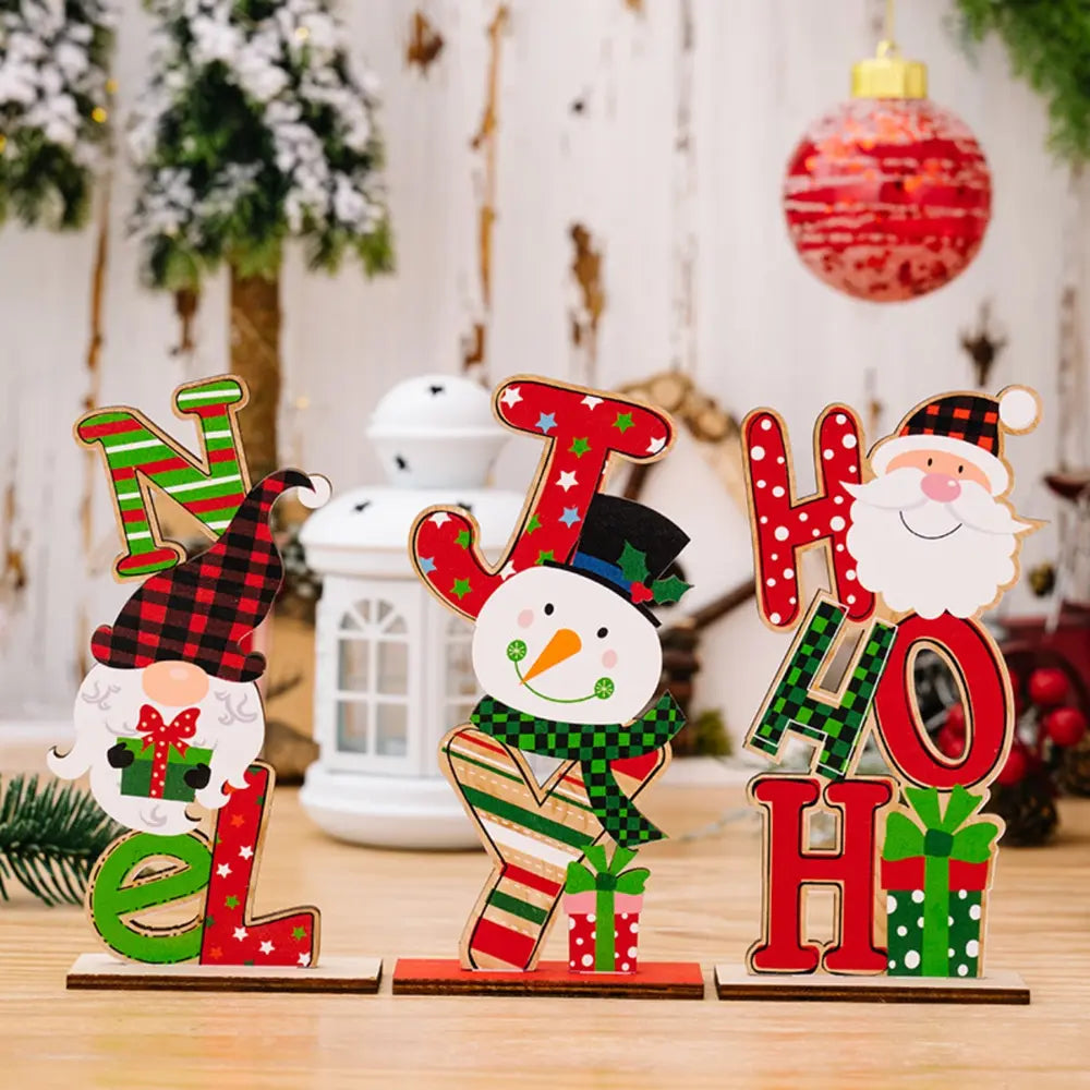 Festive wooden holiday decor trio with gnome, snowman, and Santa figures spelling out NOEL and HO HO.