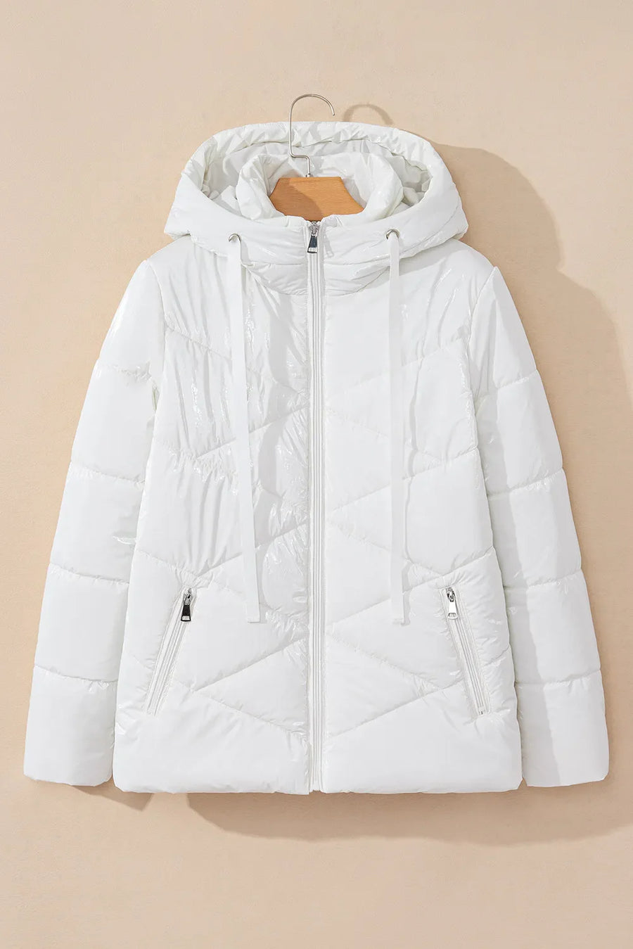 Glossy white quilted puffer jacket with a hood and zippered pockets.