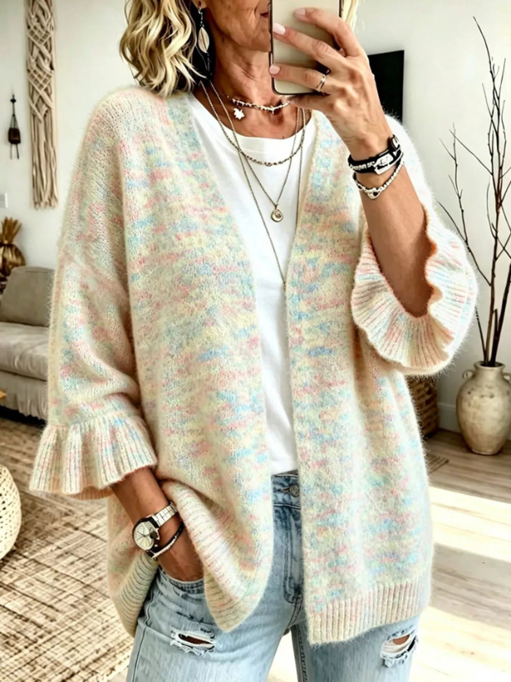 cardigan in cream featuring ruffle sleeve and relaxed fit