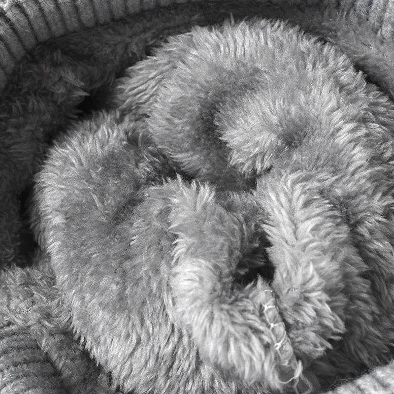 Gray knit beanie with fuzzy lining detail