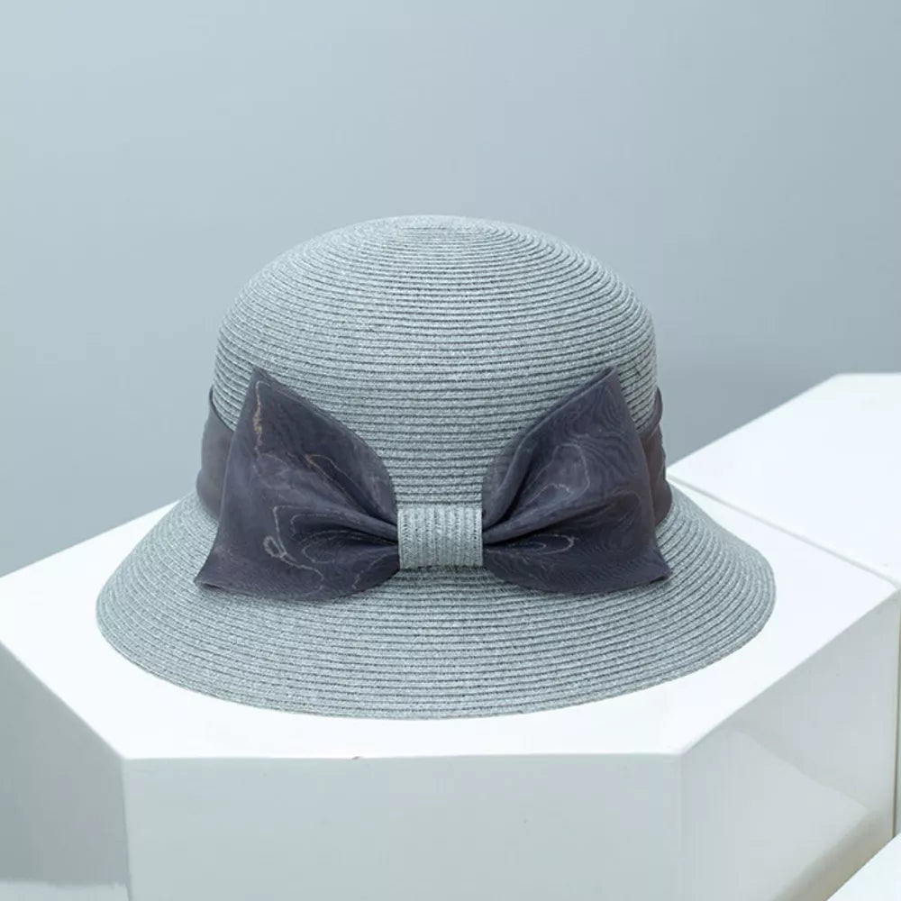 Chic gray cloche sun hat with a large sheer ribbon bow detail