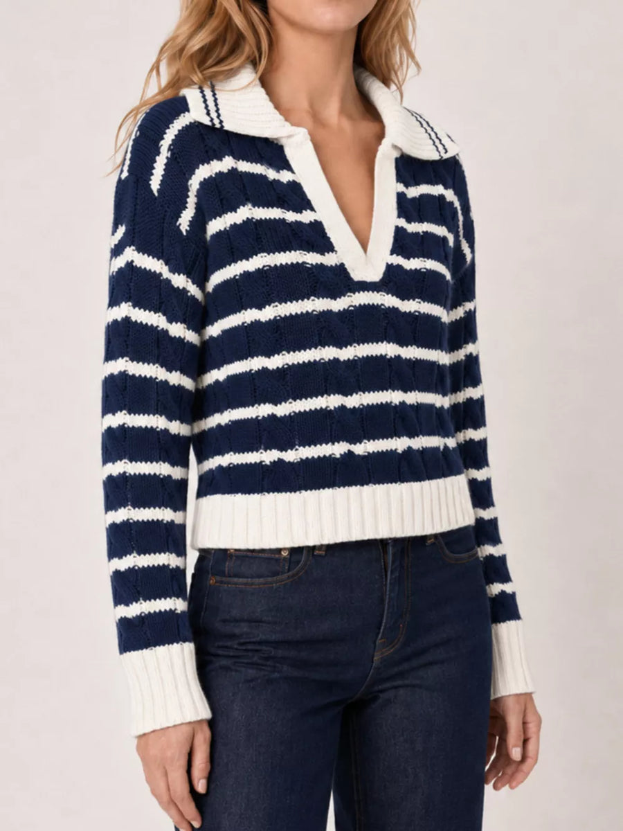 ivory pullover sweater featuring cable-knit and striped