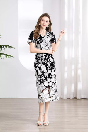 Black and white floral lace midi dress with V-neck and short sleeves.