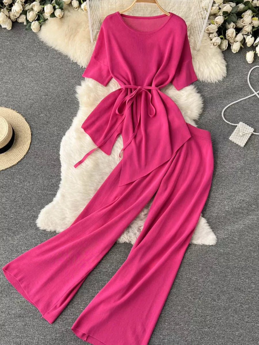 Pink tied waist two-piece set with wide leg pants and short sleeves