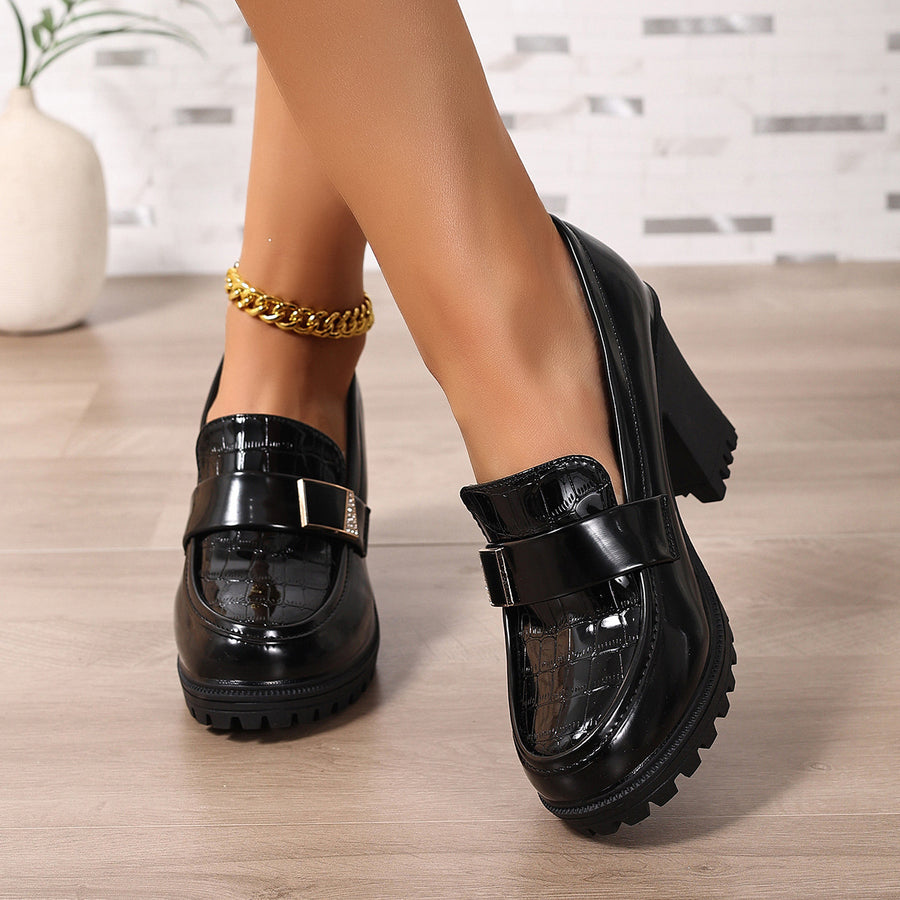 Black loafers featuring chunky heel and crocodile-embossed