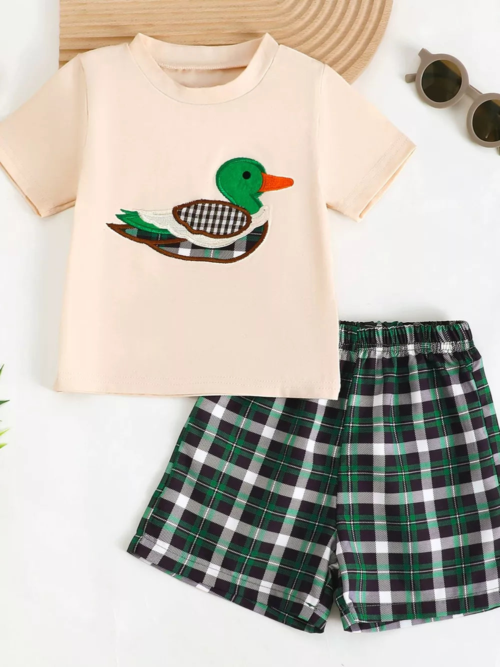 Baby set with duck appliqué on cream tee and green plaid shorts