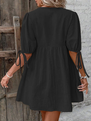 Black tie front puff sleeve mini dress with adjustable sleeve ties
