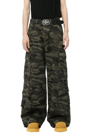 Wide-leg camo cargo pants with multiple pockets and a green camouflage pattern.