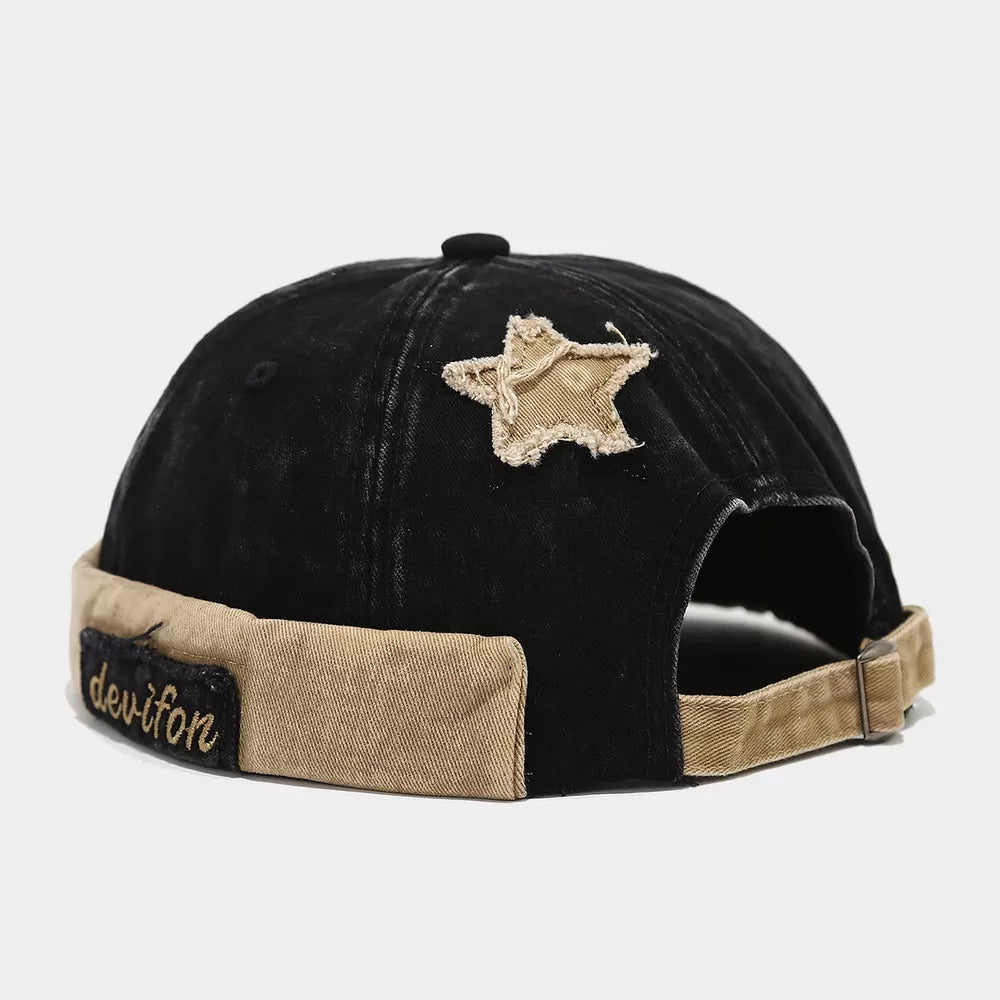hat in black featuring distressed and relaxed fit