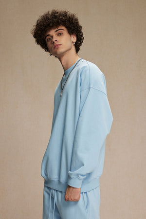 Light blue crewneck sweatshirt with long sleeves