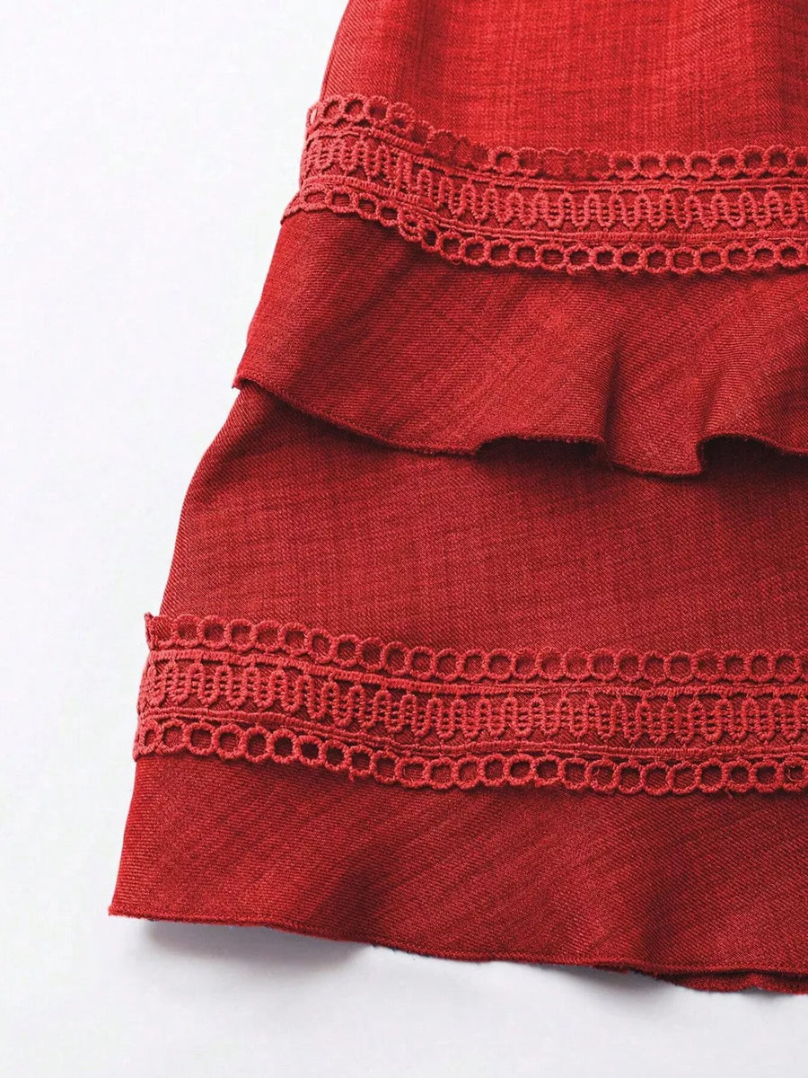 Red mini dress with tiered ruffles and lace trim detail