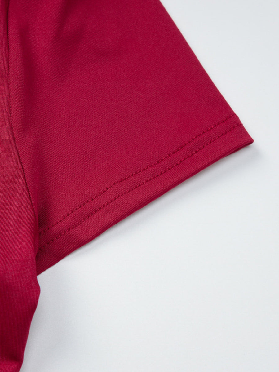Fitted one-shoulder t-shirt in deep red with double-stitched hem detail.