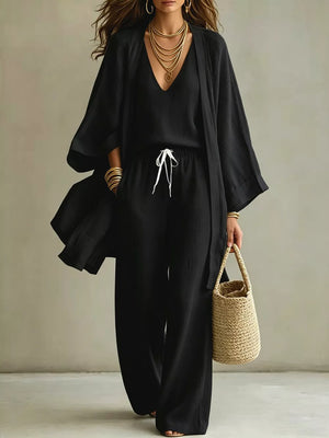 Black linen blend wide leg pants and V-neck top with open front cardigan, drawstring waist.