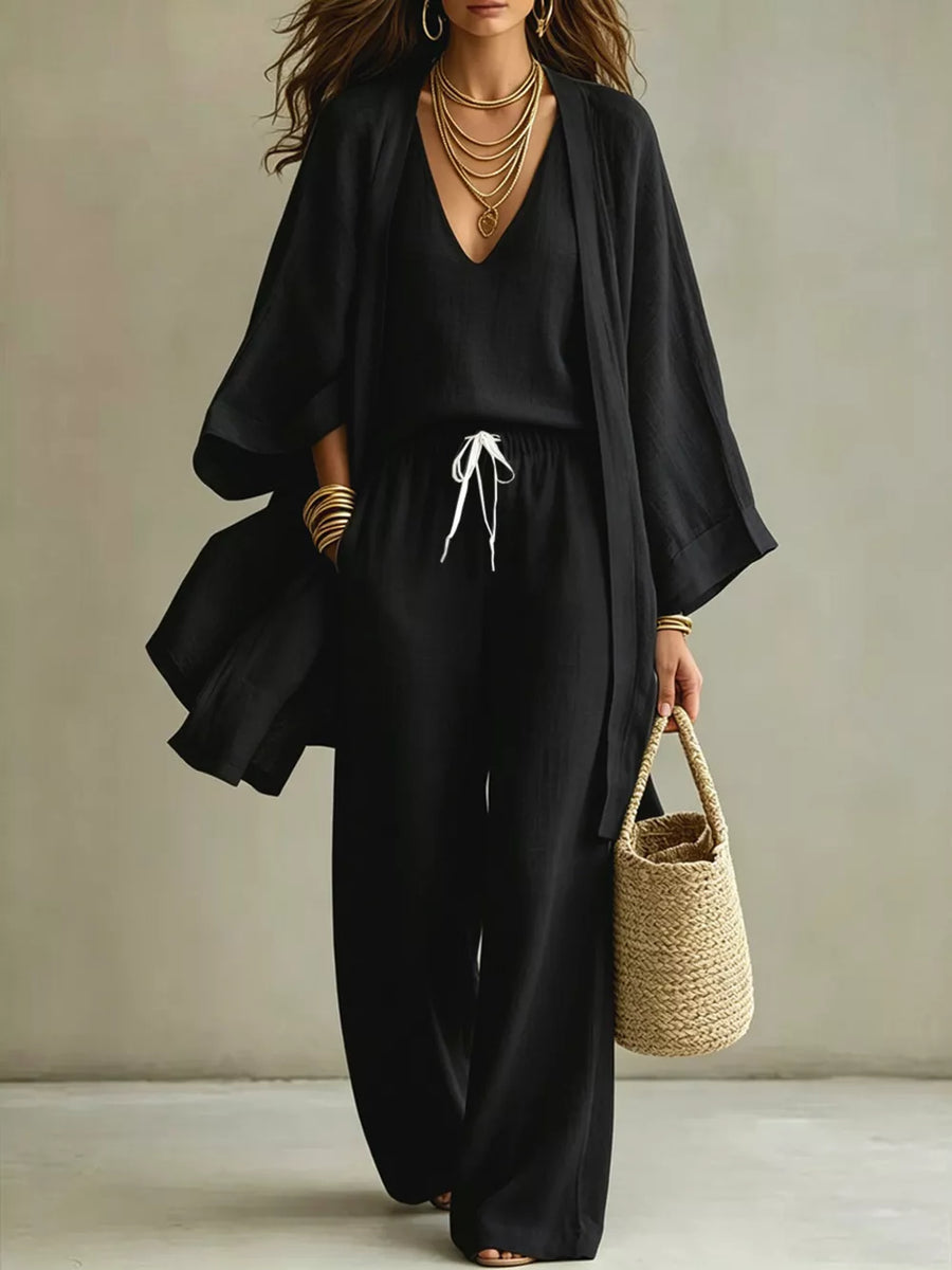 Black linen blend wide leg pants and V-neck top with open front cardigan, drawstring waist.