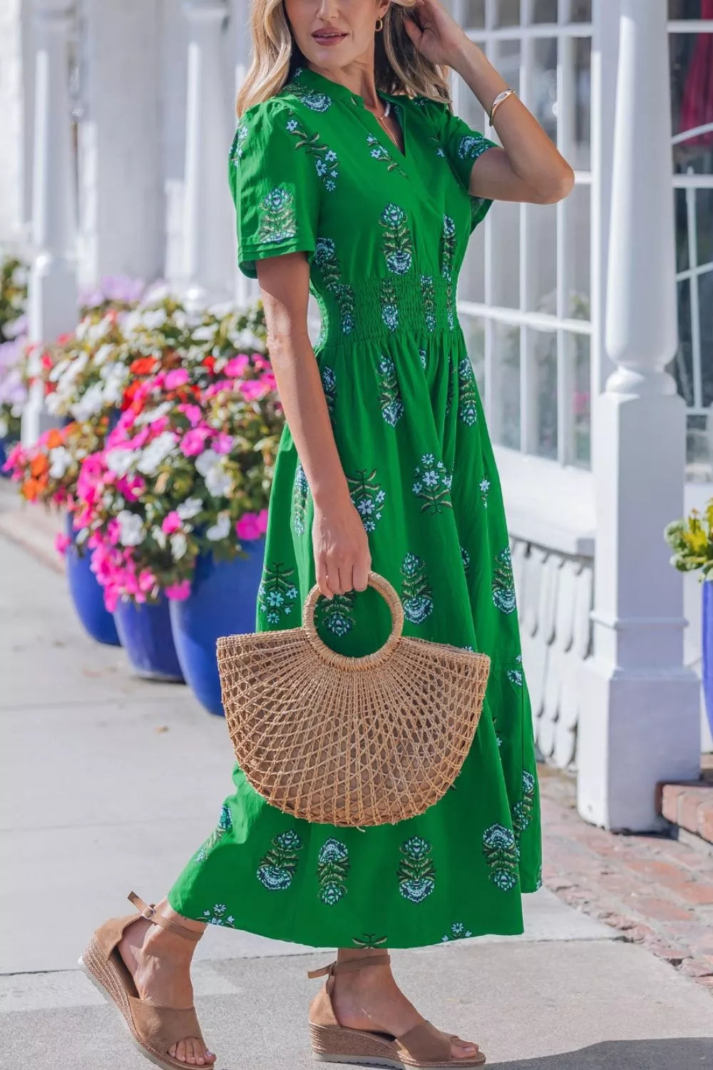 Vibrant green floral maxi dress with smocked waist, short sleeves, and V-neck.