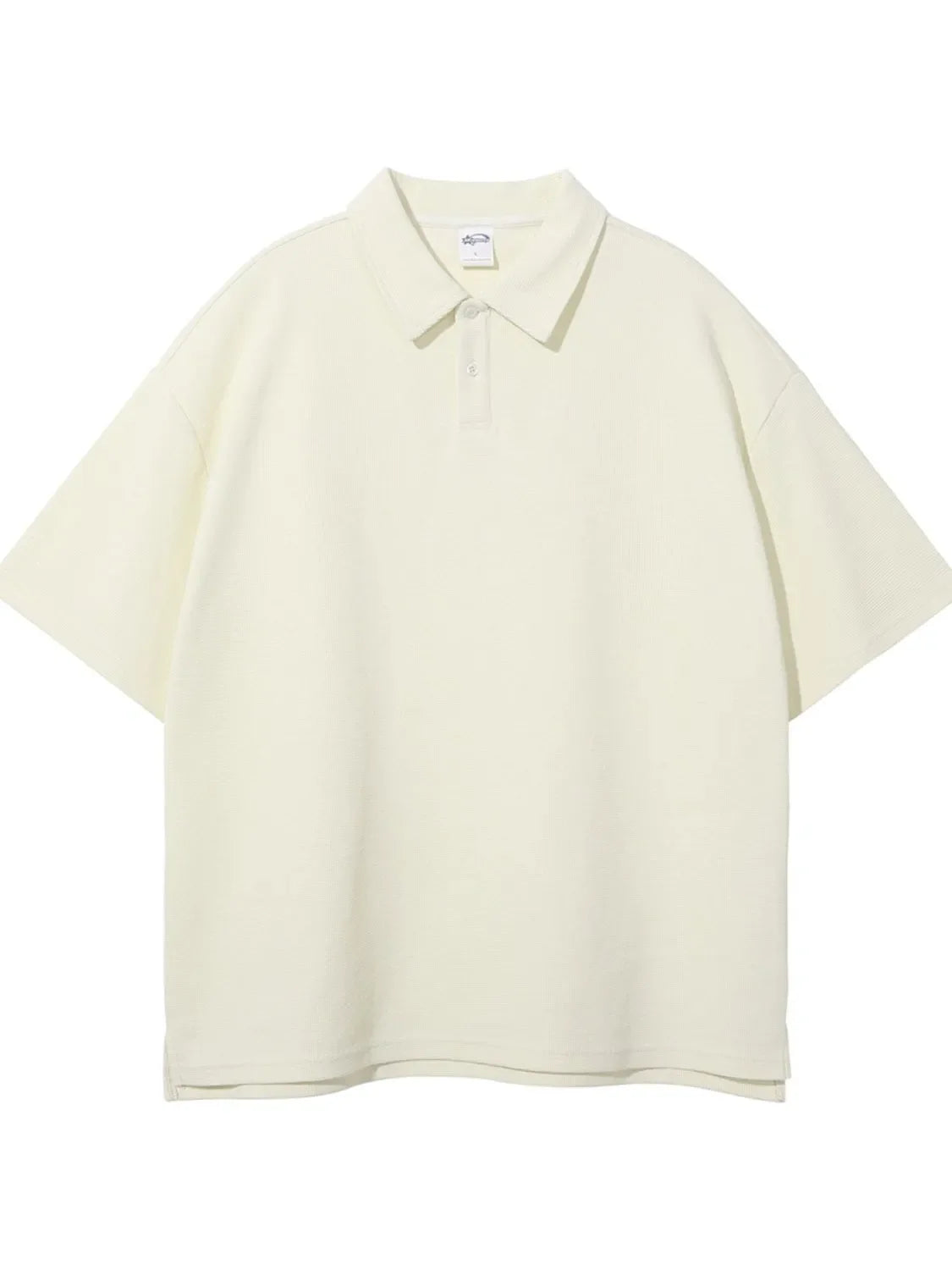 Boxy ivory textured polo shirt with short sleeves and a two-button placket.