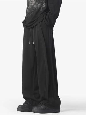 Men's black loose fit drawstring pants with a comfortable casual style.