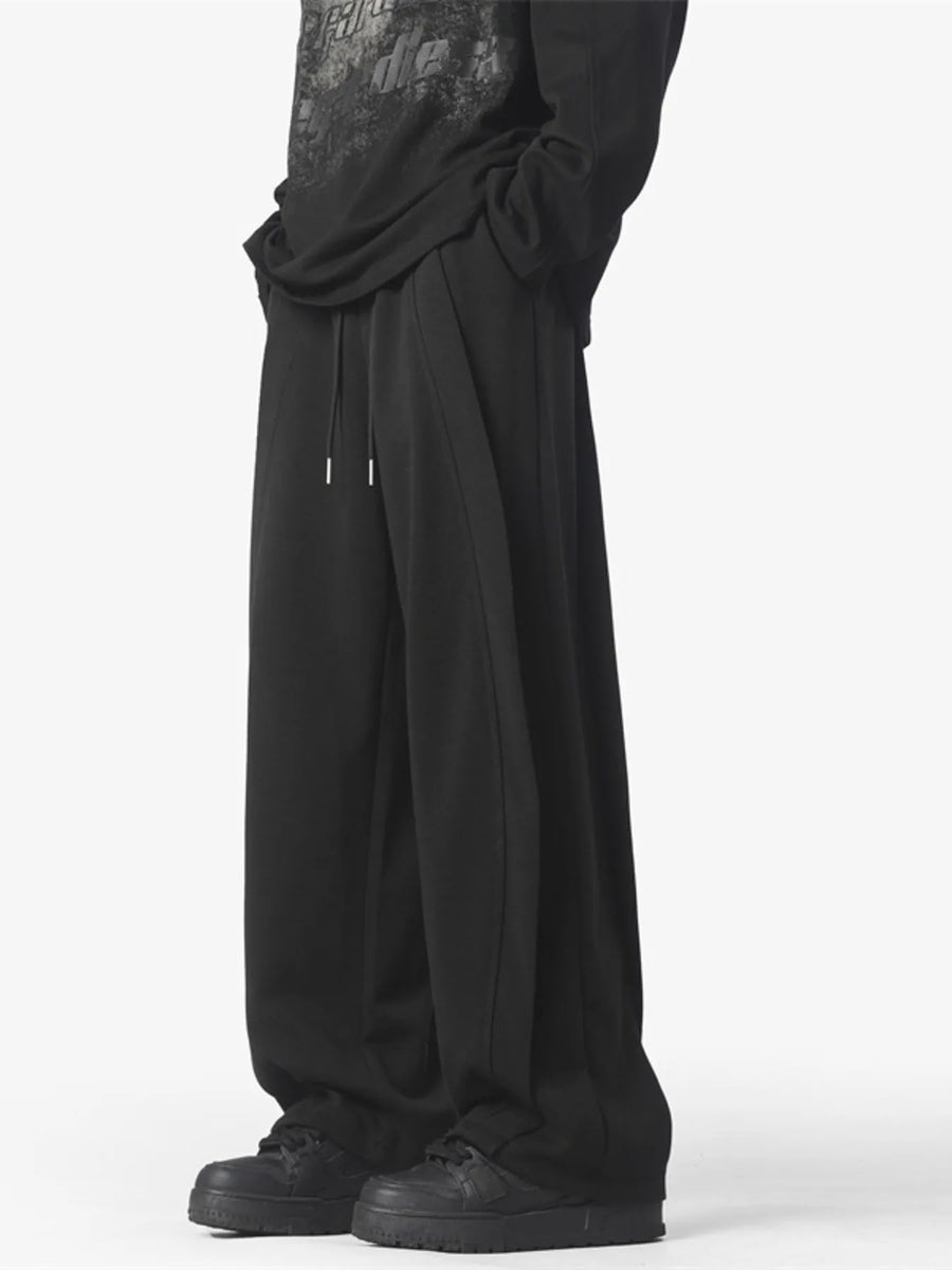 Men's black loose fit drawstring pants with a comfortable casual style.