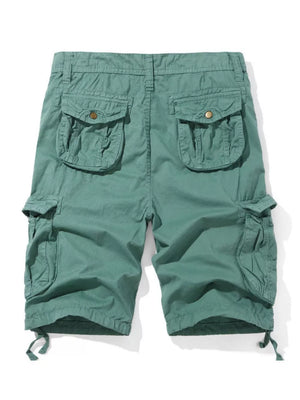 Men's army green cargo shorts with multiple button-flap pockets and drawstring hems.