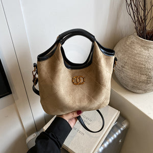 Quilted suede shopper bag in Khaki with diamond pattern and gold logo detail.