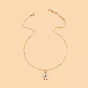 Gold evil eye hamsa pendant necklace with rhinestone details