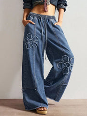 wide-leg jeans in medium blue featuring distressed and flared fit