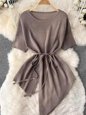 Tied waist knit set in khaki with wide legs and asymmetric hem.