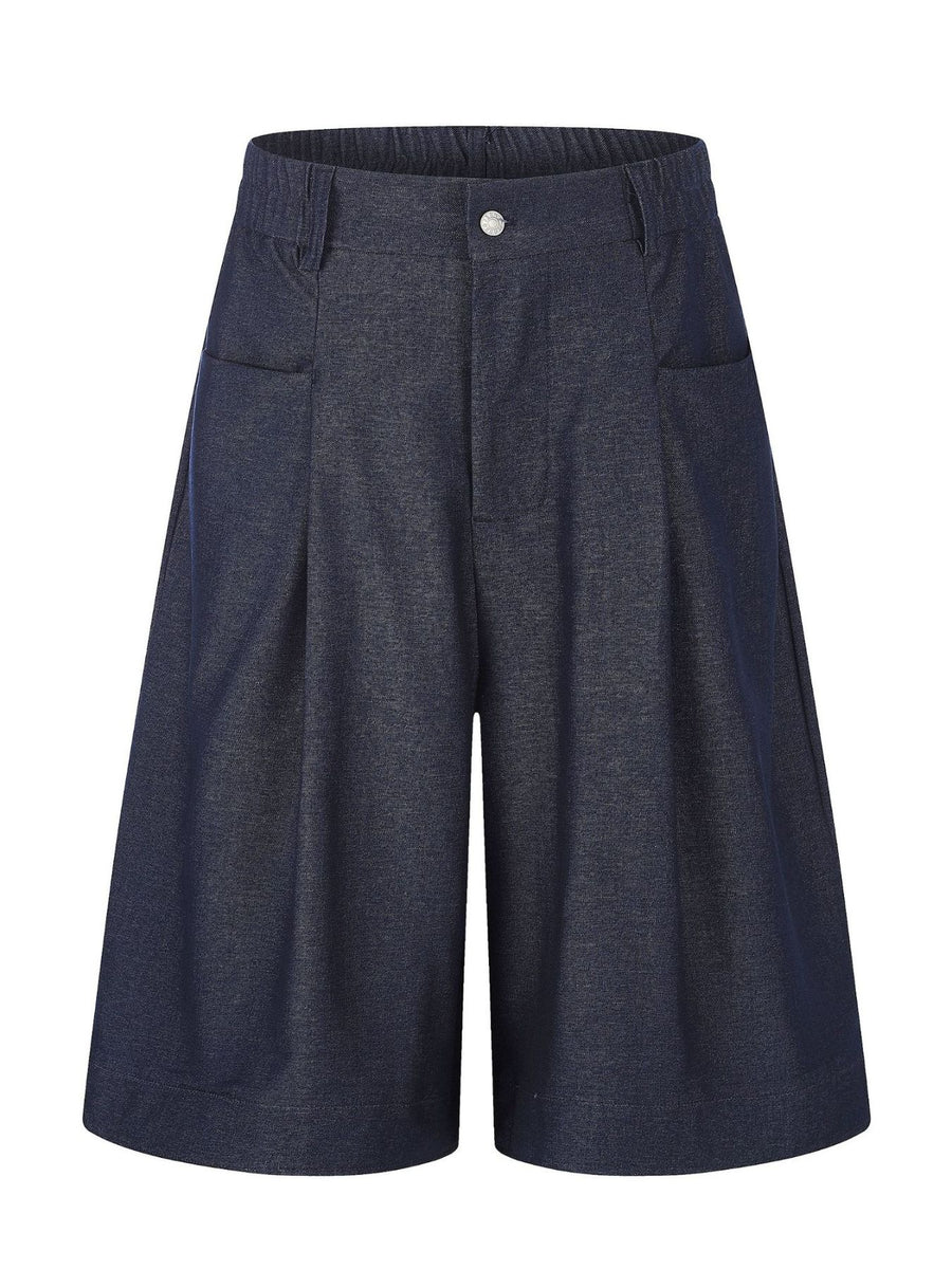 pants in indigo featuring pleated front and wide-leg fit